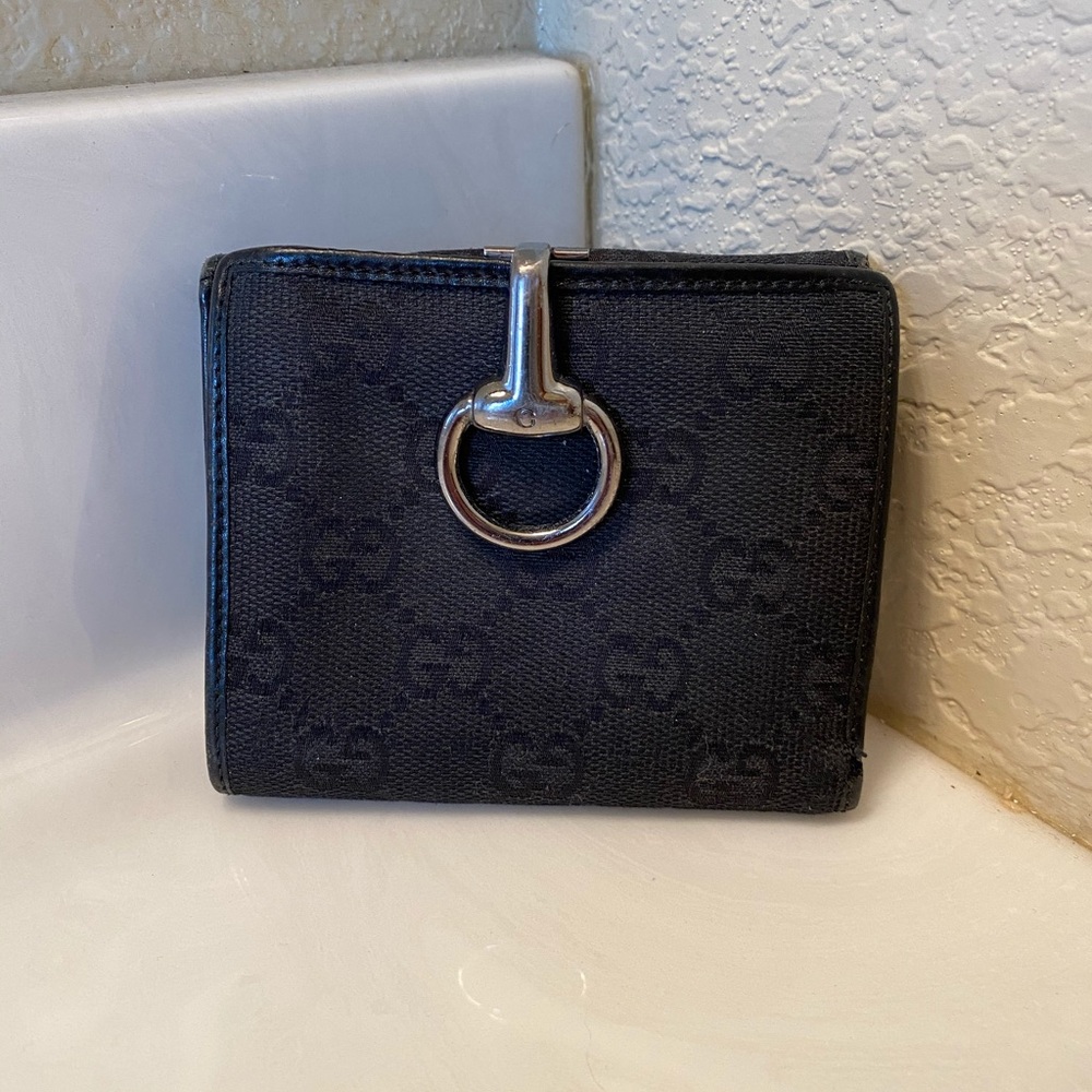 Gucci Monogram Glam French Flap wallet.